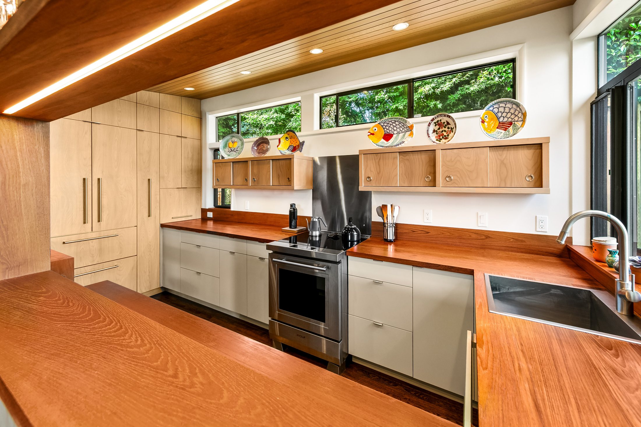 View Ridge Seattle kitchen remodel with warm wood counters, custom cabinetry, and a wood ceiling