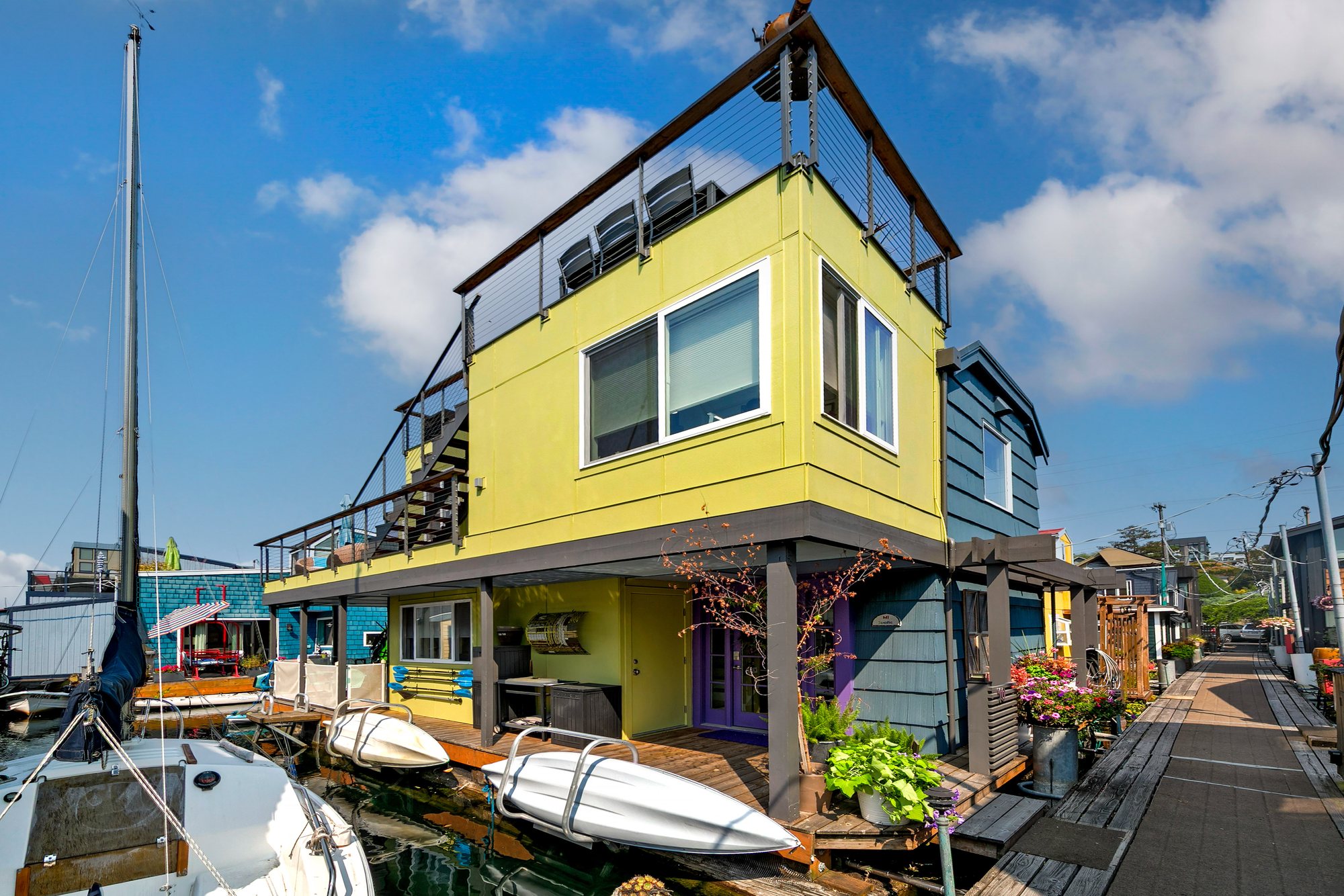 Side exterior of the Floating Home with rooftop railing