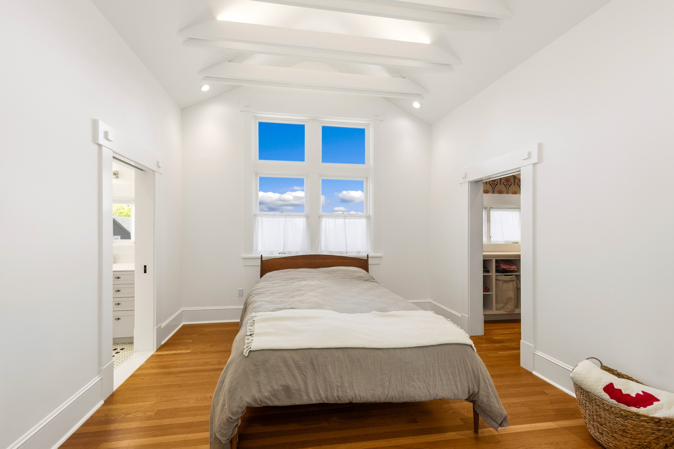 Wide view of the bright Madrona primary bedroom