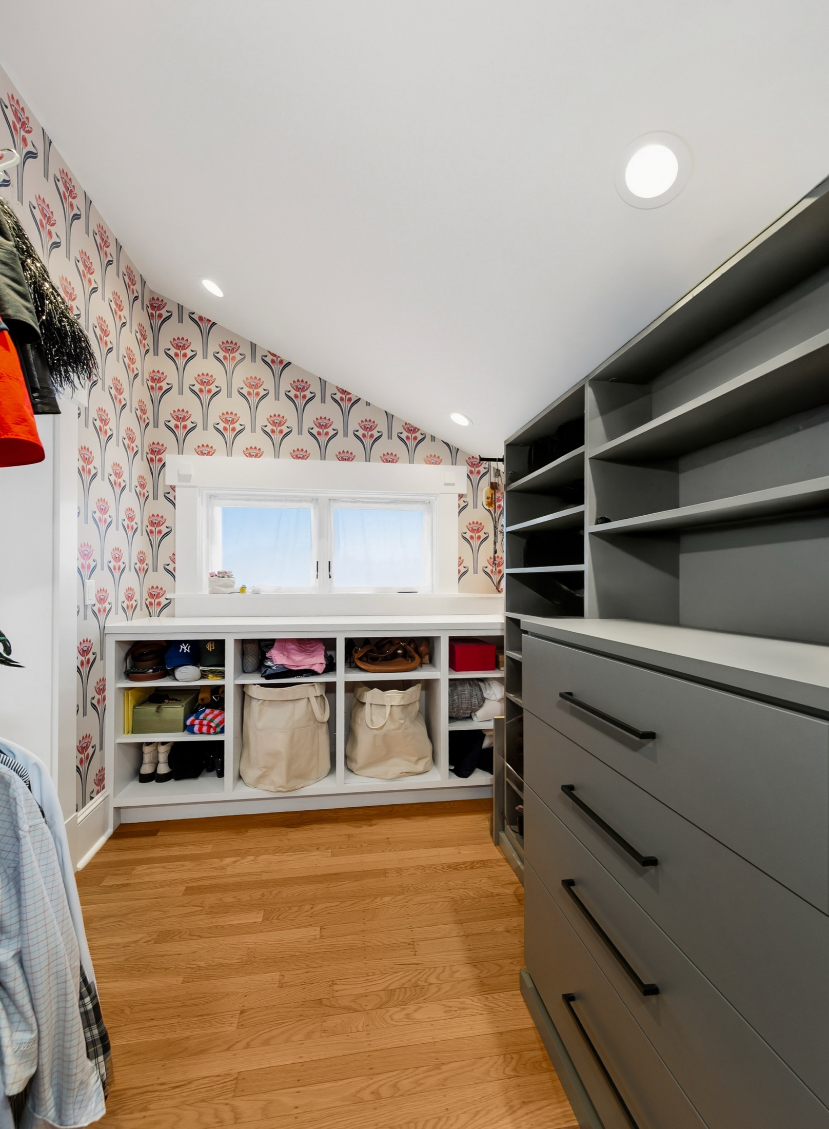 Walk-in closet with custom storage adjoining the bedroom