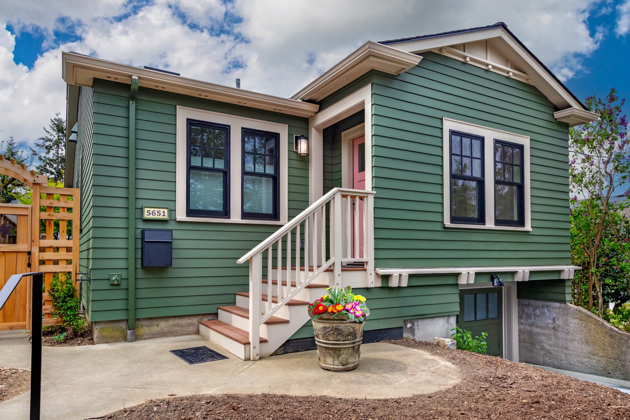Tangletown addition with garden steps and green siding