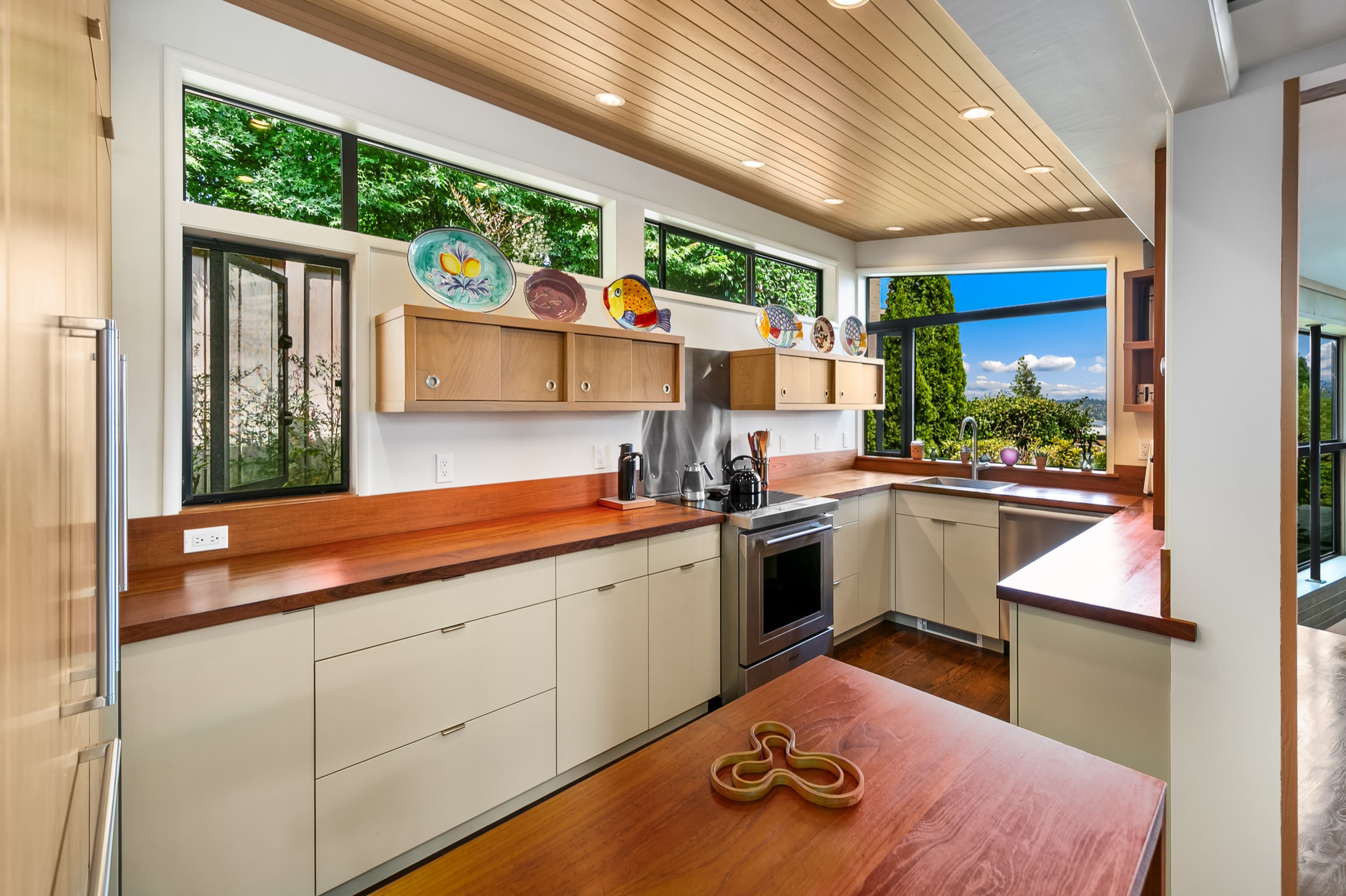Wide view of the View Ridge MCM kitchen with wood counters and custom cabinetry