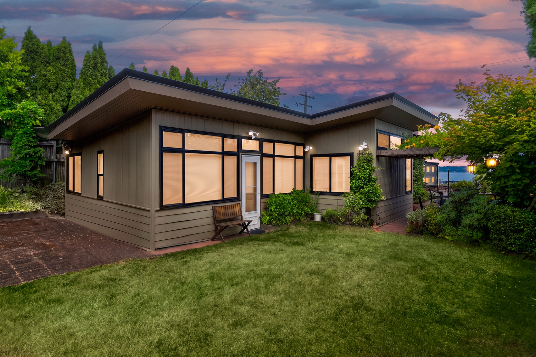 View Ridge mid-century modern home illuminated at twilight